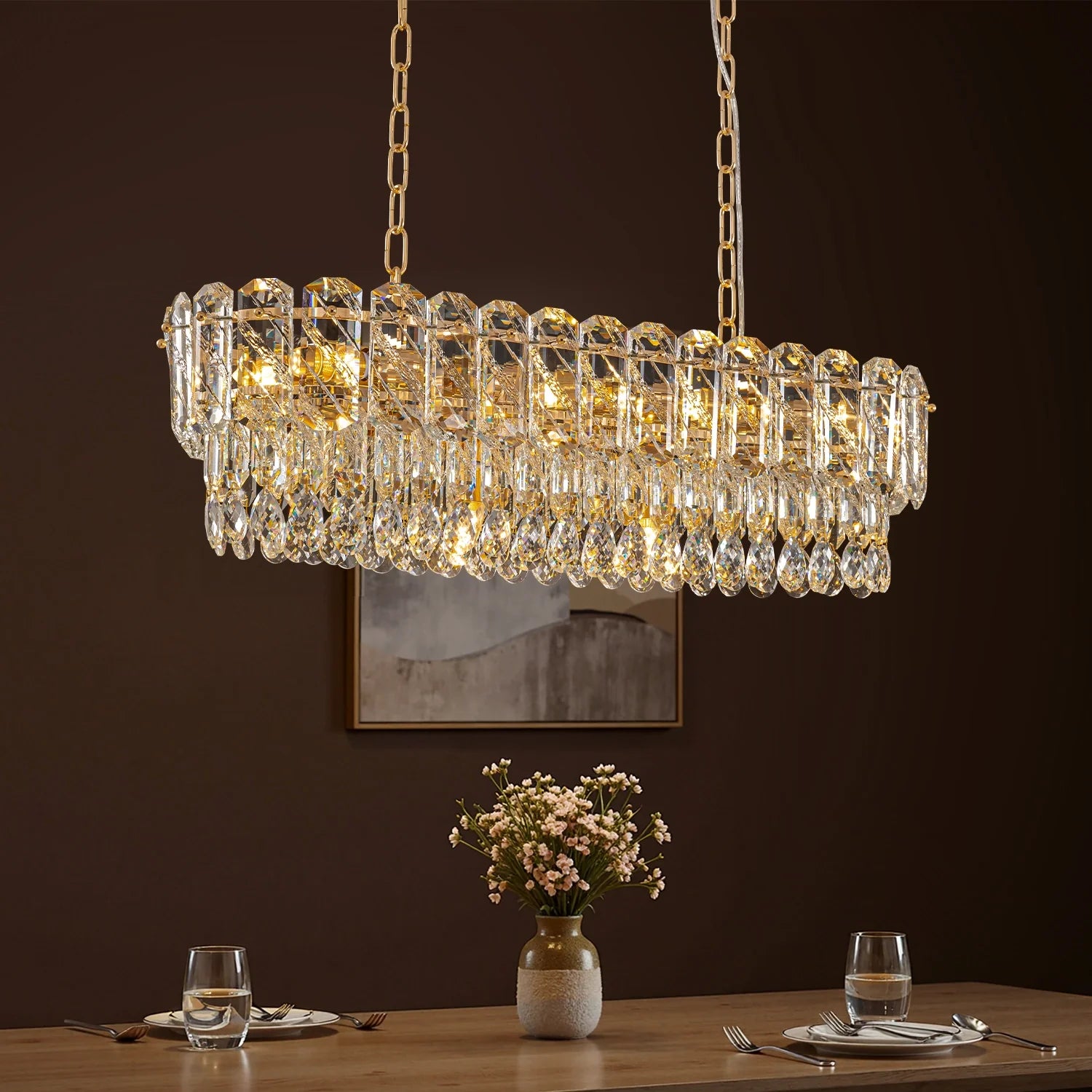 elara-gold-crystal-rectangular-chandelier-over-a-dining-room-sofary-lighting